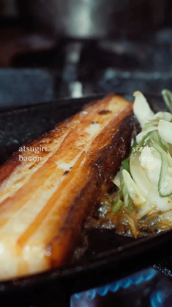 The Atsugiri Bacon is served straight from the stove to your table piping hot on a sizzling plate.