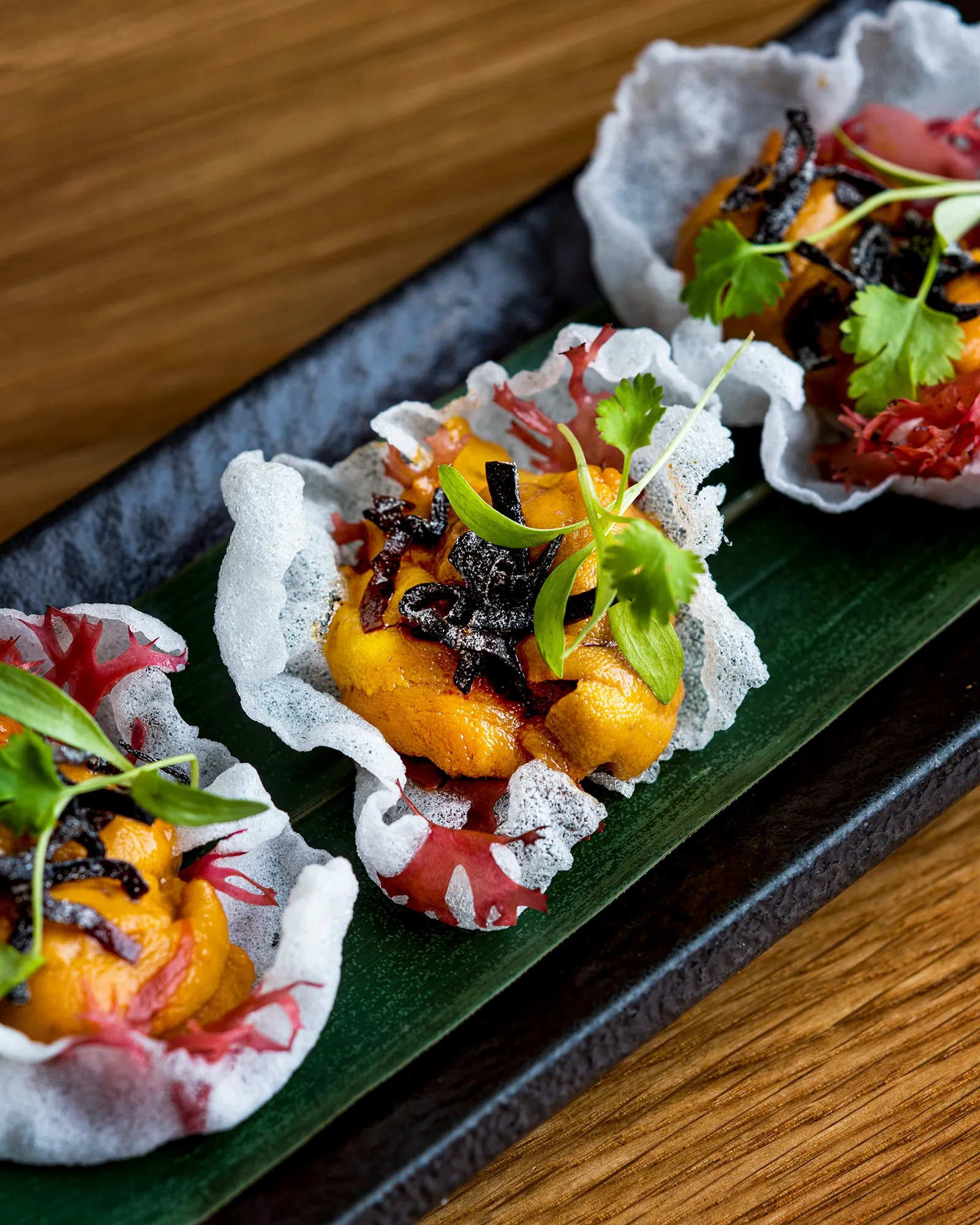 SoHo exclusive❗The Uni Canapés comes with fresh sea urchin, tosaka seaweed, shio konbu, puffed rice paper, and micro cilantro.